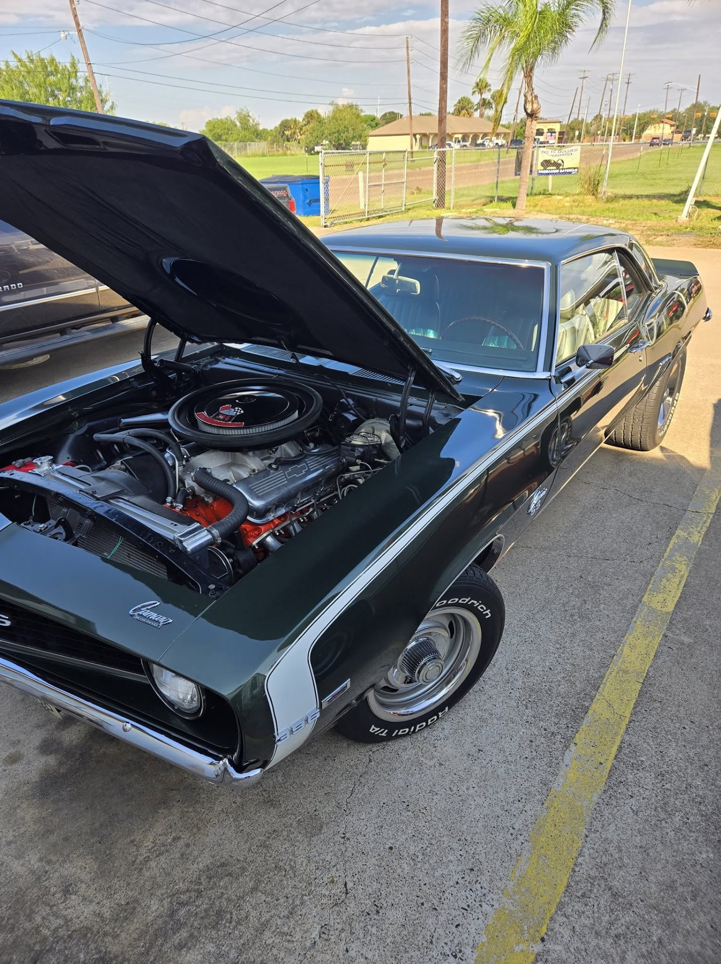 Classic Camaro SS with hood open at HotRod Garage SB